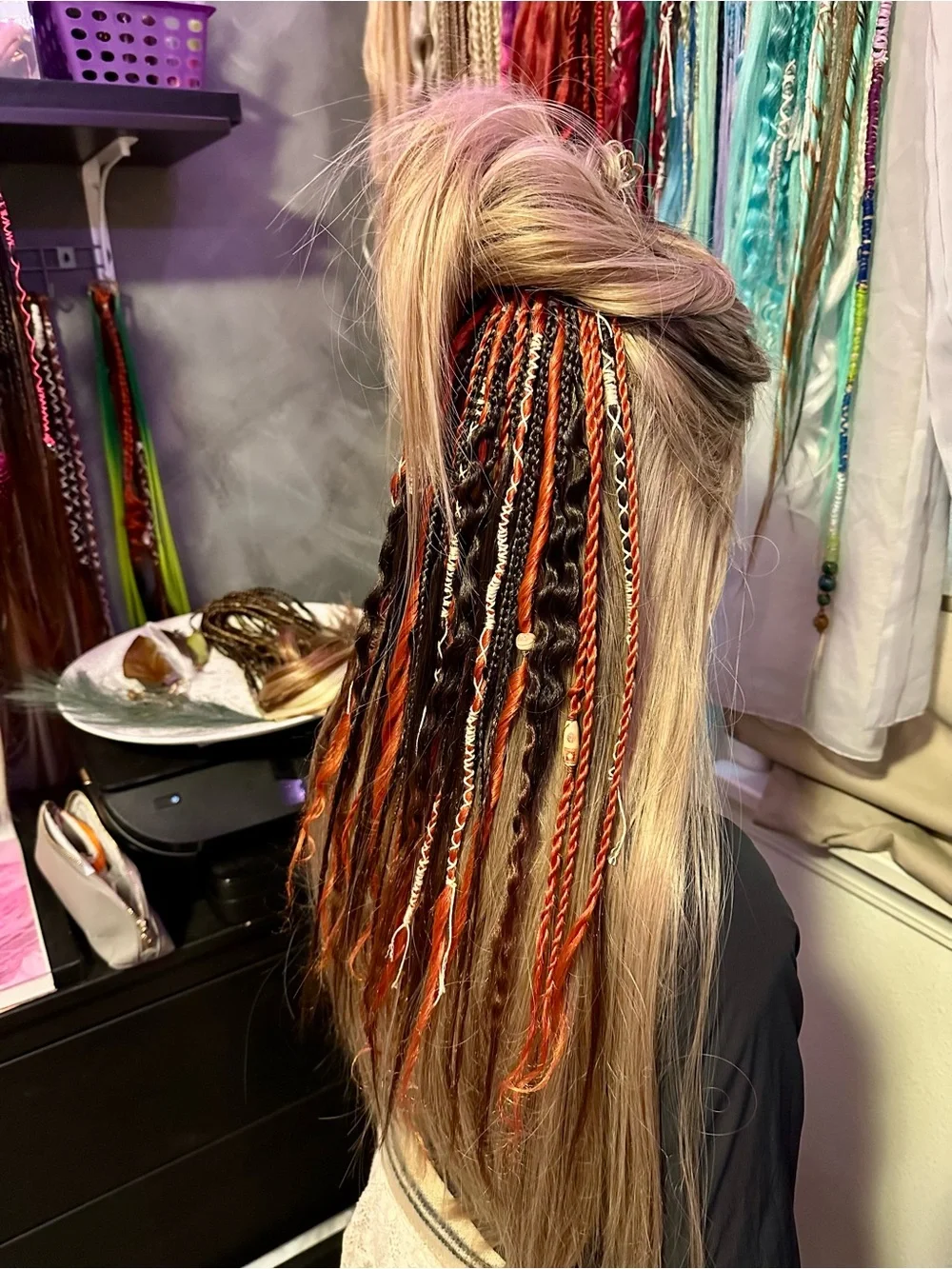 Blonde Hair Extensions with Black and Orange Braided Accents